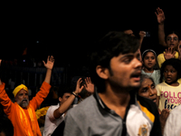 Hindu devotees are praying as they witness Ganga aarti on the ghats of the river Ganga in Varanasi, India, on June 2, 2024, after the day of...