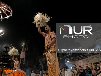 Hindu priests are worshipping during Ganga aarti on the ghats of the river Ganga in Varanasi, India, on June 2, 2024, after the day of Loksa...