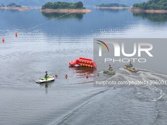 An emergency rescue drill for the 2024 Thousand Island Lake water sports leisure project is taking place in Hangzhou, China, on June 4, 2024...