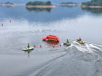 An emergency rescue drill for the 2024 Thousand Island Lake water sports leisure project is taking place in Hangzhou, China, on June 4, 2024...