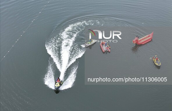 An emergency rescue drill for the 2024 Thousand Island Lake water sports leisure project is taking place in Hangzhou, China, on June 4, 2024...