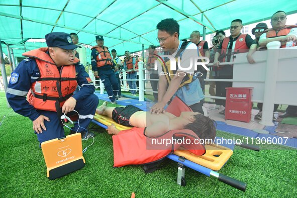 An emergency rescue drill for the 2024 Thousand Island Lake water sports leisure project is taking place in Hangzhou, China, on June 4, 2024...