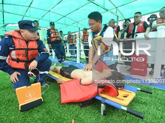 An emergency rescue drill for the 2024 Thousand Island Lake water sports leisure project is taking place in Hangzhou, China, on June 4, 2024...