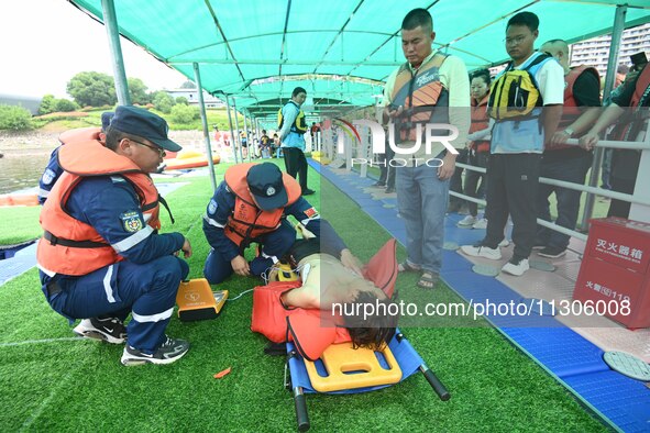 An emergency rescue drill for the 2024 Thousand Island Lake water sports leisure project is taking place in Hangzhou, China, on June 4, 2024...