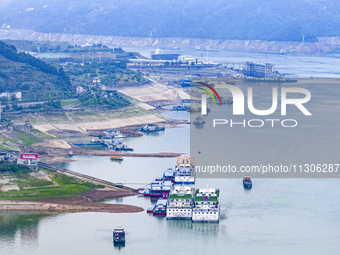 The water level in front of the Three Gorges Reservoir is falling to 145.56 meters above sea level in Yichang, China, on June 5, 2024. The T...