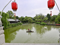 Volunteers are cleaning up floating objects on a river in Qingzhou, China, on June 5, 2024. (