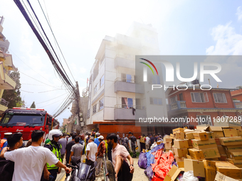 Smoke is billowing from a building that hosts the godown of a confectionery supplier in Kathmandu, Nepal, on June 5, 2024. Fire incidents ar...