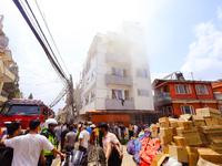 Smoke is billowing from a building that hosts the godown of a confectionery supplier in Kathmandu, Nepal, on June 5, 2024. Fire incidents ar...