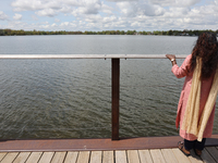 A woman is looking out towards Lake Wilcox in Richmond Hill, Ontario, Canada, on May 12, 2024. (