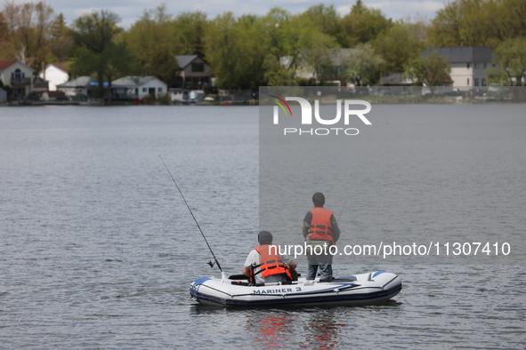 People are fishing along Lake Wilcox in Richmond Hill, Ontario, Canada, on May 12, 2024. 