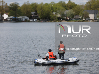 People are fishing along Lake Wilcox in Richmond Hill, Ontario, Canada, on May 12, 2024. (