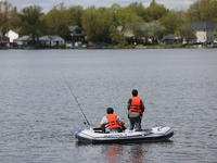 People are fishing along Lake Wilcox in Richmond Hill, Ontario, Canada, on May 12, 2024. (