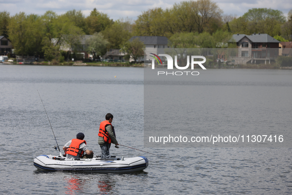 People are fishing along Lake Wilcox in Richmond Hill, Ontario, Canada, on May 12, 2024. 