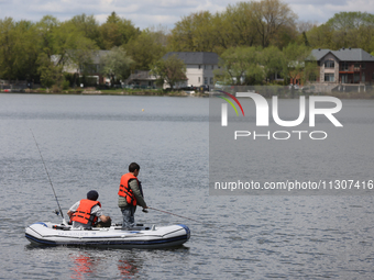 People are fishing along Lake Wilcox in Richmond Hill, Ontario, Canada, on May 12, 2024. (