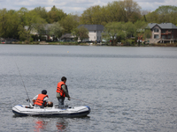 People are fishing along Lake Wilcox in Richmond Hill, Ontario, Canada, on May 12, 2024. (