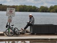 A woman is standing by Lake Wilcox in Richmond Hill, Ontario, Canada, on May 12, 2024. (