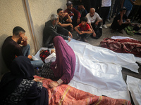 Palestinians are mourning relatives killed in Israeli bombardment of a house in al-Maghazi refugee camp, at the Al-Aqsa Martyrs Hospital in...