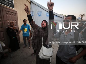 Palestinians are mourning relatives killed in Israeli bombardment of a house in al-Maghazi refugee camp, at the Al-Aqsa Martyrs Hospital in...