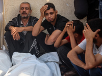 Palestinians are mourning relatives killed in Israeli bombardment of a house in al-Maghazi refugee camp, at the Al-Aqsa Martyrs Hospital in...