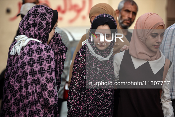 Palestinians are mourning relatives killed in Israeli bombardment of a house in al-Maghazi refugee camp, at the Al-Aqsa Martyrs Hospital in...