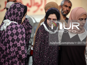 Palestinians are mourning relatives killed in Israeli bombardment of a house in al-Maghazi refugee camp, at the Al-Aqsa Martyrs Hospital in...