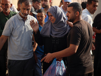 Palestinians are mourning relatives killed in Israeli bombardment of a house in al-Maghazi refugee camp, at the Al-Aqsa Martyrs Hospital in...