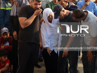 Palestinians are mourning relatives killed in Israeli bombardment of a house in al-Maghazi refugee camp, at the Al-Aqsa Martyrs Hospital in...