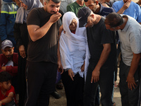 Palestinians are mourning relatives killed in Israeli bombardment of a house in al-Maghazi refugee camp, at the Al-Aqsa Martyrs Hospital in...