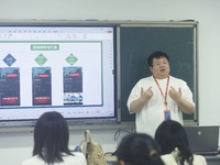 A teacher is teaching students how to make short videos in a classroom in Hangzhou, China, on June 5, 2024. (