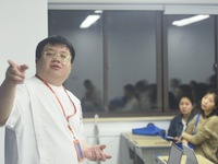 A teacher is teaching students how to make short videos in a classroom in Hangzhou, China, on June 5, 2024. (