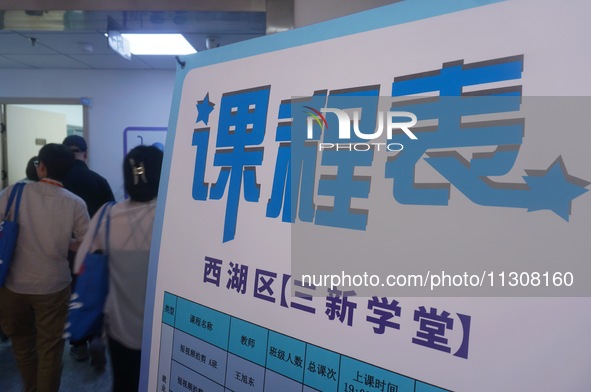 Students are walking into a school to learn new skills in Hangzhou, China, on June 5, 2024. 