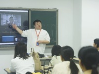 A teacher is teaching students how to make short videos in a classroom in Hangzhou, China, on June 5, 2024. (