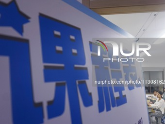 A teacher is teaching students how to make short videos in a classroom in Hangzhou, China, on June 5, 2024. (