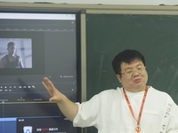 A teacher is teaching students how to make short videos in a classroom in Hangzhou, China, on June 5, 2024. (