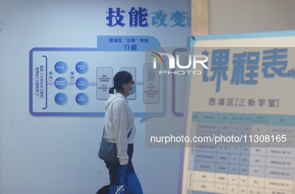 Students are walking into a school to learn new skills in Hangzhou, China, on June 5, 2024. 