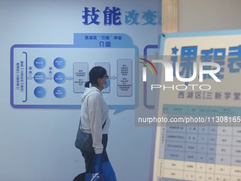 Students are walking into a school to learn new skills in Hangzhou, China, on June 5, 2024. (