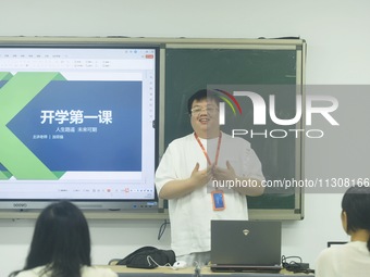 A teacher is teaching students how to make short videos in a classroom in Hangzhou, China, on June 5, 2024. (