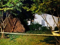 A fallen tree rests inside a home on Dogwood Drive in Gaithersburg, Maryland on June 5, 2024, after a tornado swept through the region. (