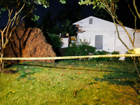 A fallen tree rests inside a home on Dogwood Drive in Gaithersburg, Maryland on June 5, 2024, after a tornado swept through the region. (