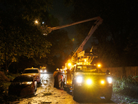 Utility crews make repairs in a Gaithersburg, Maryland neighborhood on June 5, 2024, after a tornado swept through the region. (