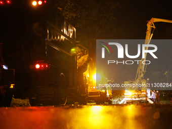 Utility crews make repairs in a Gaithersburg, Maryland neighborhood on June 5, 2024, after a tornado swept through the region. (