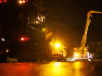 Utility crews make repairs in a Gaithersburg, Maryland neighborhood on June 5, 2024, after a tornado swept through the region. (