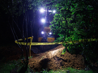 Workers from Washington Gas dig a hole on a property that was destroyed by a fallen tree in Gaithersburg, Maryland on June 5, 2024, after a...