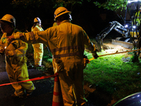 Workers from Washington Gas dig a hole on a property that was destroyed by a fallen tree in Gaithersburg, Maryland on June 5, 2024, after a...