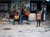 Palestinians are gathering at a UN-school that was hit during Israeli bombardment in Nuseirat, in the central Gaza Strip, on June 6, 2024, a...