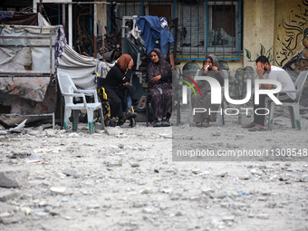 Palestinians are gathering at a UN-school that was hit during Israeli bombardment in Nuseirat, in the central Gaza Strip, on June 6, 2024, a...