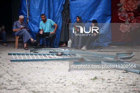 Palestinians are gathering at a UN-school that was hit during Israeli bombardment in Nuseirat, in the central Gaza Strip, on June 6, 2024, a...