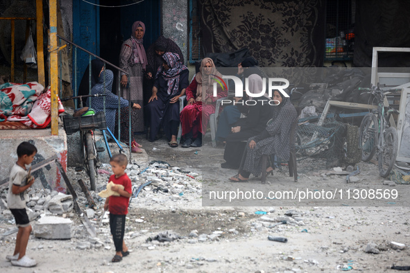 Palestinians are gathering at a UN-school that was hit during Israeli bombardment in Nuseirat, in the central Gaza Strip, on June 6, 2024, a...