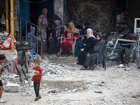 Palestinians are gathering at a UN-school that was hit during Israeli bombardment in Nuseirat, in the central Gaza Strip, on June 6, 2024, a...