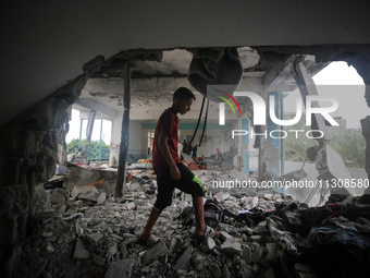 Palestinians are checking a UN-school that was hit during Israeli bombardment in Nuseirat, in the central Gaza Strip, on June 6, 2024, amid...